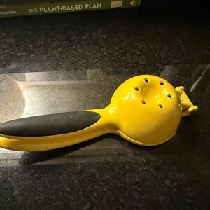 Yellow Citrus Juicer with Black Handle
